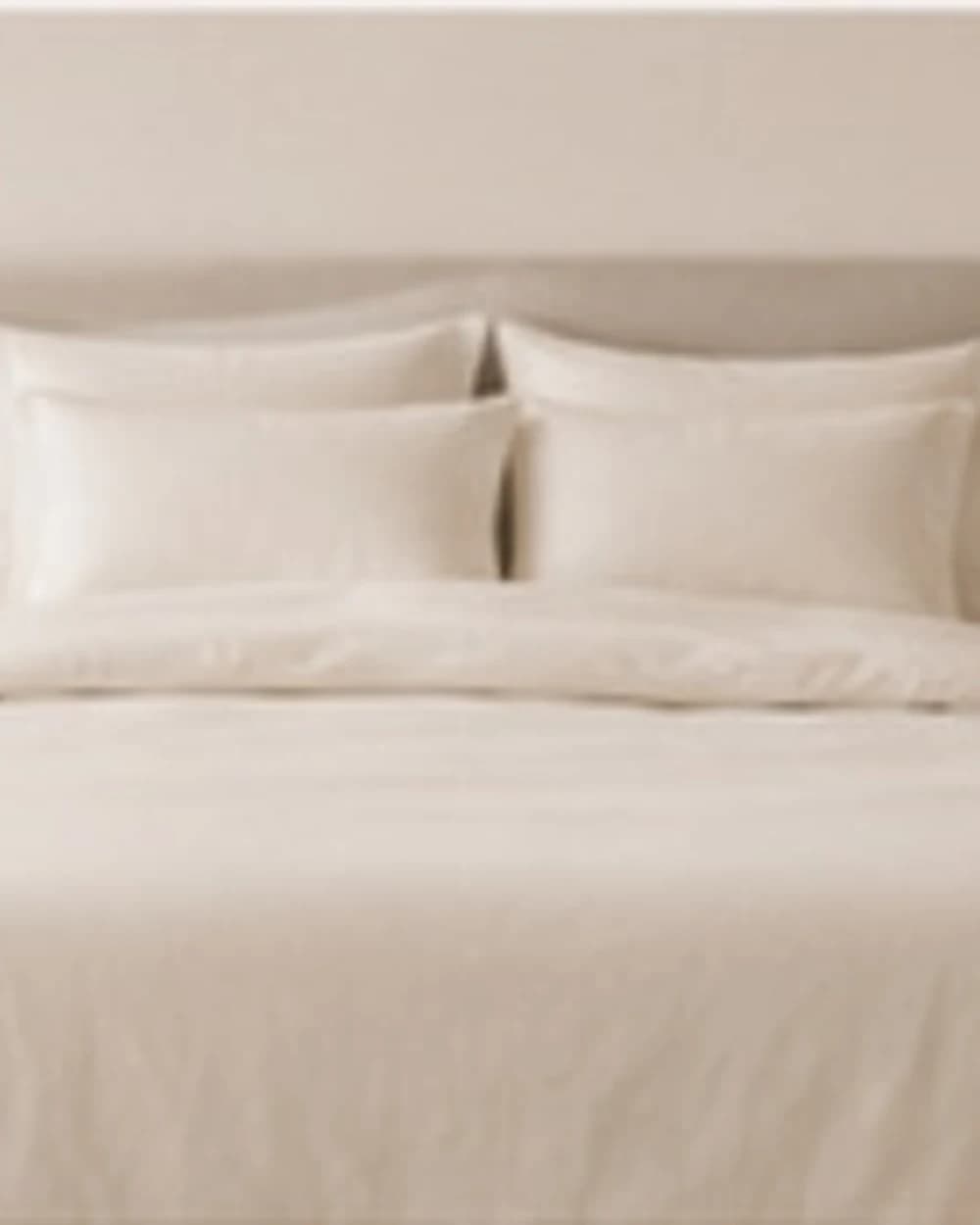 Natural linen duvet cover on a bed