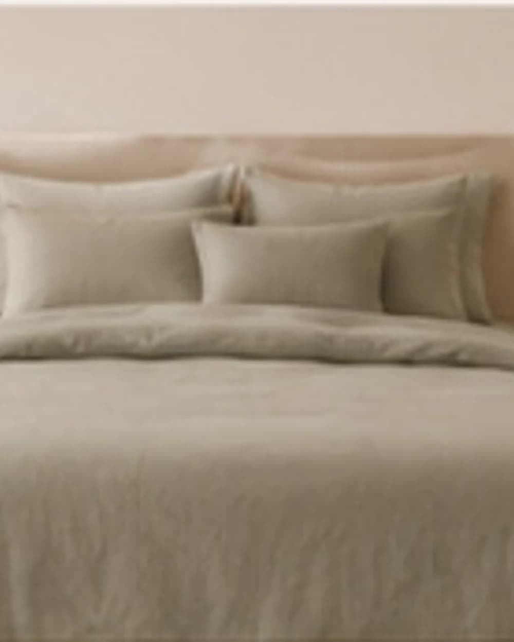 Sand beige duvet on a timber bed