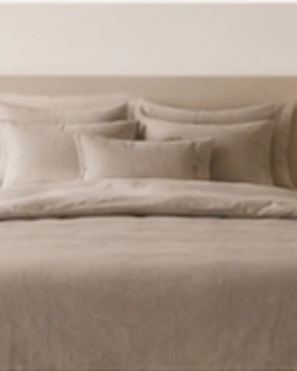 Ivory sateen bedding in soft light