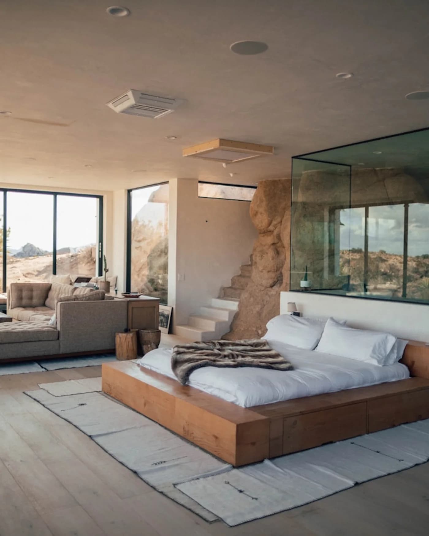 Natural linen bedding in sunlit plaster rooms
