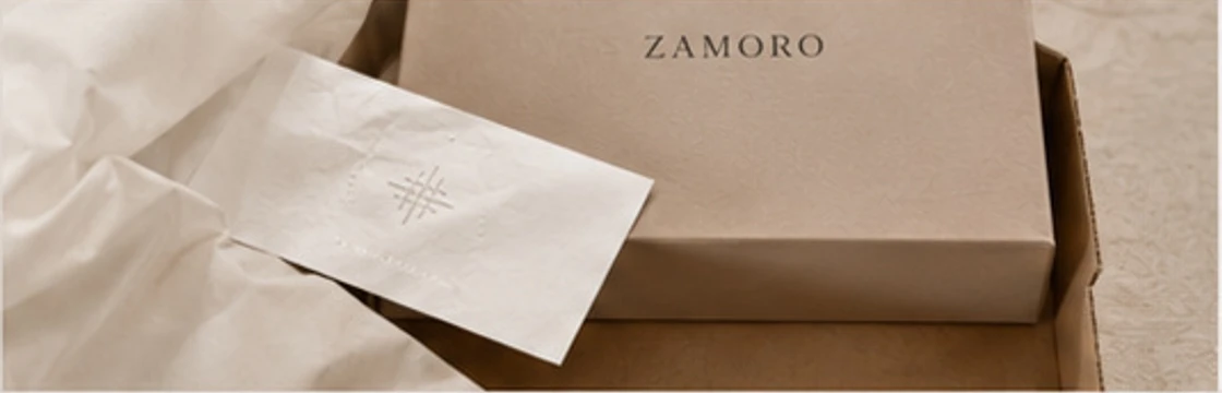Zamoro branded box with tissue paper and collection card in premium packaging